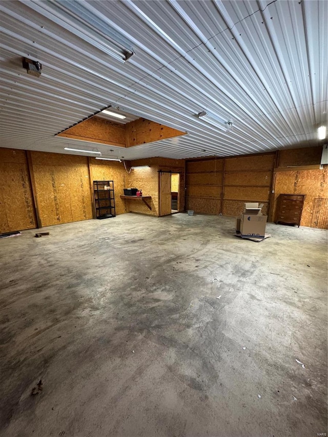 9 Summit Ln, Hermann, MO 65041 - miscellaneous room featuring a garage and unfinished concrete floors