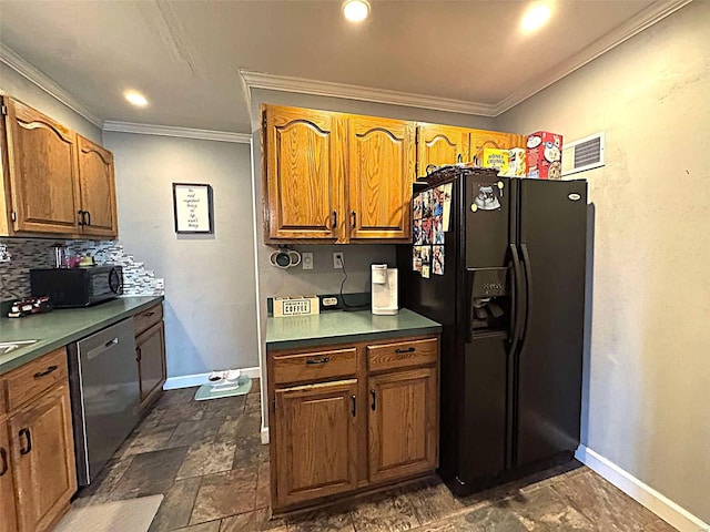 kitchen featuring black appliances, baseboards, crown molding, decorative backsplash, and dark stone finish flooring
