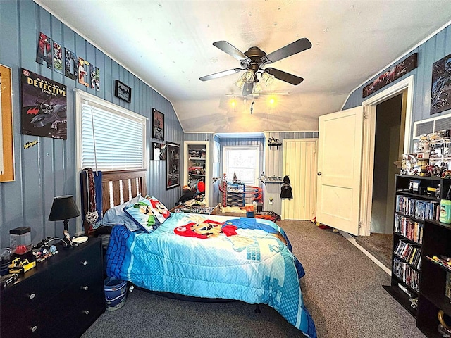 carpeted bedroom with lofted ceiling and a ceiling fan