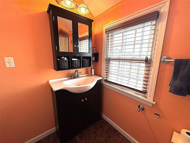 bathroom featuring baseboards, vanity, and tile patterned floors