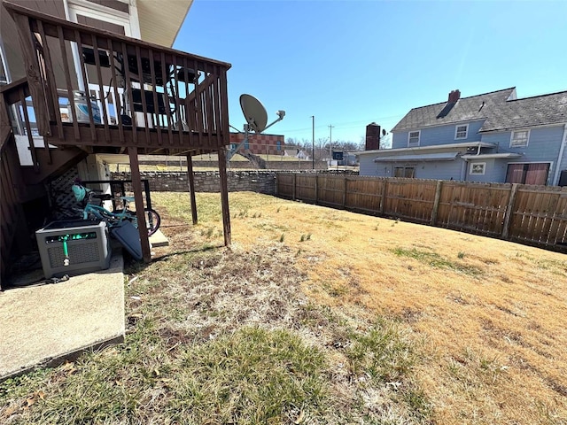 view of yard featuring a deck and stairway