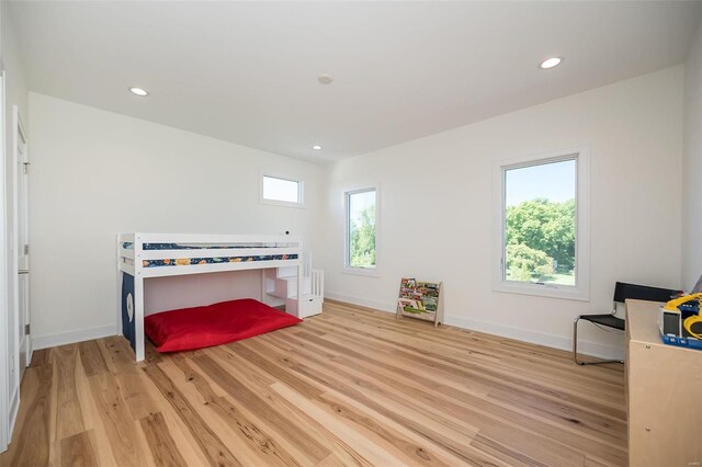bedroom featuring light wood-style flooring, baseboards, and recessed lighting