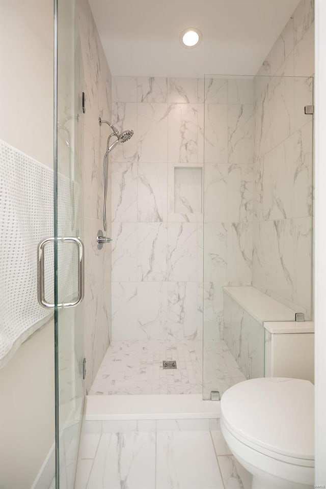 full bath featuring marble finish floors, a marble finish shower, recessed lighting, and toilet