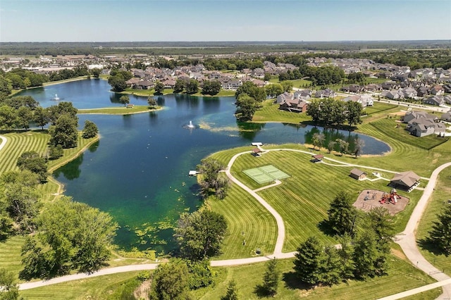 aerial view of residential area featuring a nearby body of water