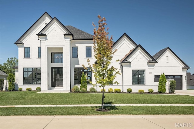 1205 Patchwork Flds, Chesterfield, MO 63005 - french country inspired facade featuring a front lawn, a garage, driveway, and brick siding