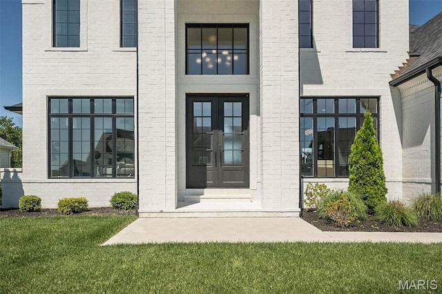 1205 Patchwork Flds, Chesterfield, MO 63005 - doorway to property with french doors and brick siding