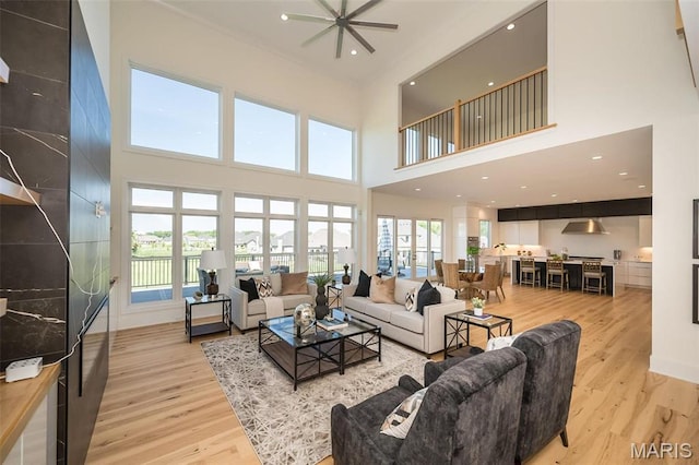 1205 Patchwork Flds, Chesterfield, MO 63005 - living room featuring light wood-type flooring, a high ceiling, a ceiling fan, and recessed lighting