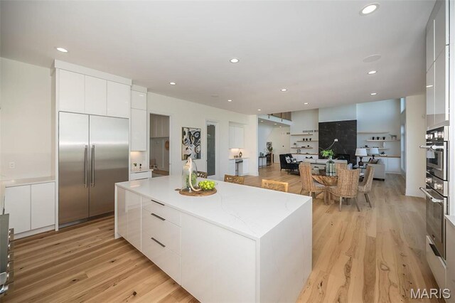 1205 Patchwork Flds, Chesterfield, MO 63005 - kitchen featuring modern cabinets, stainless steel built in fridge, a kitchen island, white cabinets, and recessed lighting