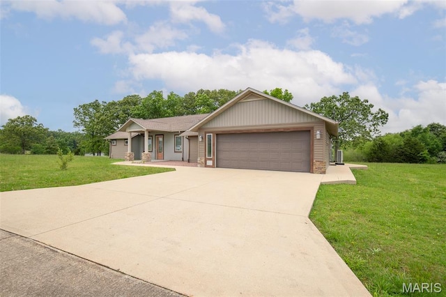 232 Confederate Ridge Rd, Doniphan, MO 63935 - single story home with a garage, a front yard, concrete driveway, covered porch, and stone siding