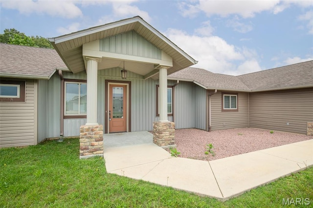 232 Confederate Ridge Rd, Doniphan, MO 63935 - property entrance with board and batten siding, a yard, and roof with shingles