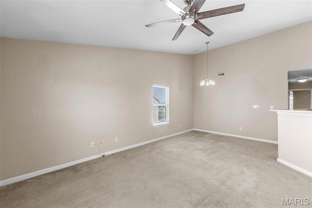 638 Homerun Dr Unit 36N, Ofallon, MO 63366 - carpeted empty room featuring baseboards, ceiling fan, and a chandelier