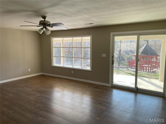 1770 Pigg Hollow Rd, Owensville, MO 65066 - unfurnished living room featuring baseboards, a ceiling fan, a textured ceiling, and wood finished floors