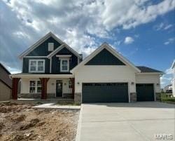 723 Kenmare Ct, Dardenne Prairie, MO 63368 - craftsman-style home with an attached garage, covered porch, and driveway