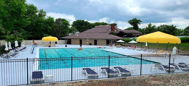 723 Kenmare Ct, Dardenne Prairie, MO 63368 - community pool with a patio and view of wooded area