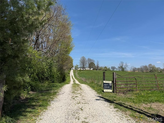 434 Whispering Wind Ln, Cape Girardeau, MO 63701 - view of dirt / gravel driveway with a view of countryside