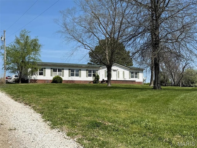 434 Whispering Wind Ln, Cape Girardeau, MO 63701 - manufactured / mobile home featuring a front lawn