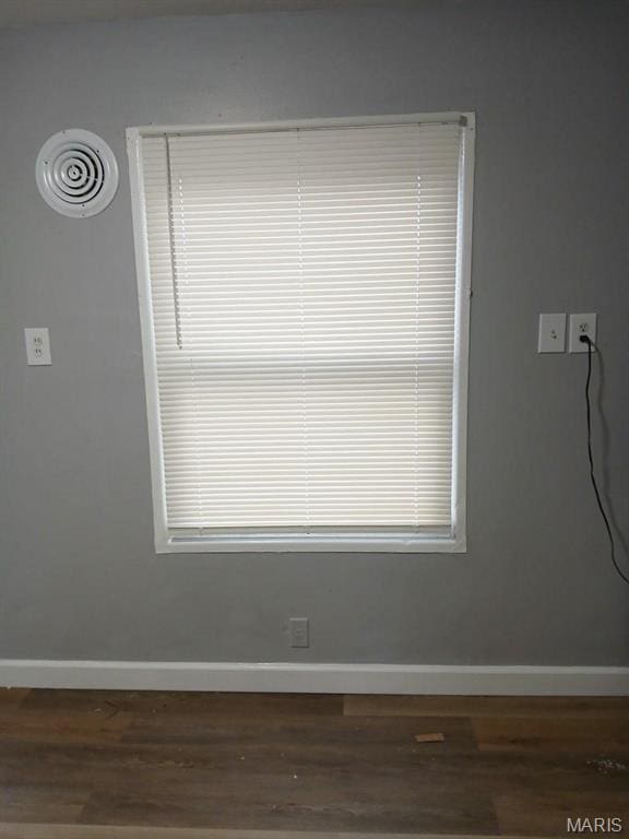 1339 Cabrillo Dr, Saint Louis, MO 63138 - detailed view of wood finished floors and baseboards