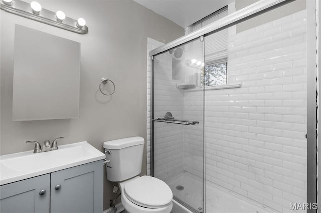 6040 Maple Ave, Saint Louis, MO 63112 - bathroom with a shower stall, toilet, and vanity