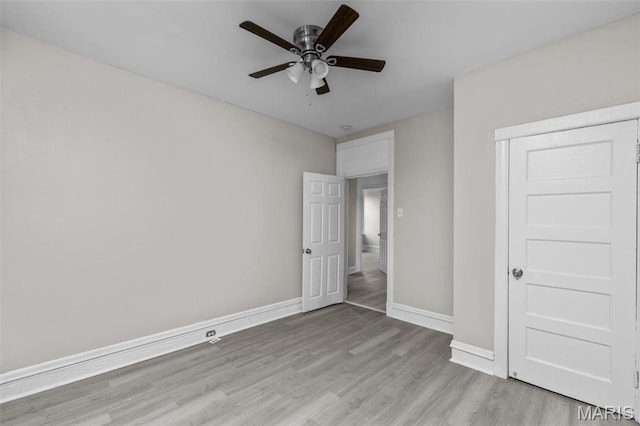 6040 Maple Ave, Saint Louis, MO 63112 - unfurnished bedroom featuring light wood-style flooring, baseboards, and ceiling fan