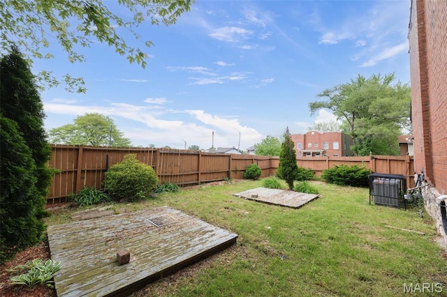 6040 Maple Ave, Saint Louis, MO 63112 - view of yard featuring central AC and a wooden deck
