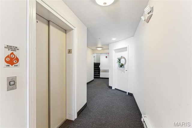 3605 Tracey Rich Unit 2B, Lemay Township, MO 63125 - hallway featuring elevator, dark colored carpet, and baseboards