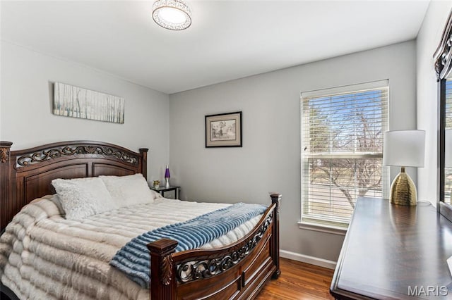 3605 Tracey Rich Unit 2B, Lemay Township, MO 63125 - bedroom with wood finished floors, multiple windows, and baseboards