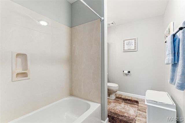3605 Tracey Rich Unit 2B, Lemay Township, MO 63125 - full bathroom featuring toilet, shower / bathtub combination, and baseboards
