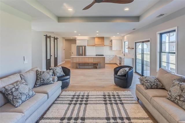 115 S Taylor St, Red Bud, IL 62278 - living room featuring light wood-style flooring, baseboards, a ceiling fan, recessed lighting, and a raised ceiling