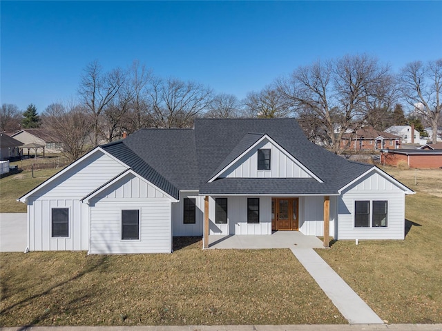 115 S Taylor St, Red Bud, IL 62278 - modern inspired farmhouse featuring board and batten siding, a shingled roof, a front lawn, and covered porch