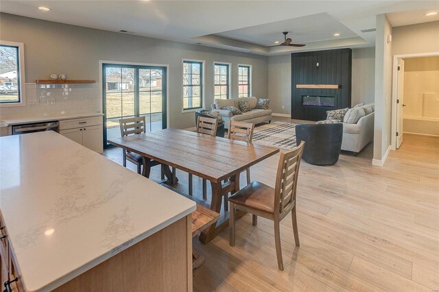 115 S Taylor St, Red Bud, IL 62278 - dining room featuring recessed lighting, light wood finished floors, a ceiling fan, a tray ceiling, and baseboards
