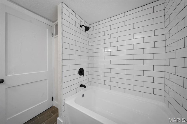 700 W Main St, Union, MO 63084 - bathroom featuring shower / washtub combination and wood finish floors