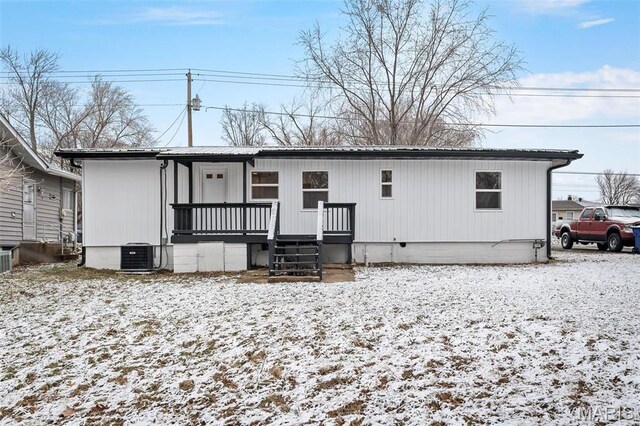 700 W Main St, Union, MO 63084 - snow covered back of property with cooling unit, metal roof, and crawl space