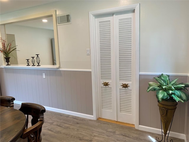2903 Lesmer Ct, Overland, MO 63114 - bathroom with a wainscoted wall and wood finished floors