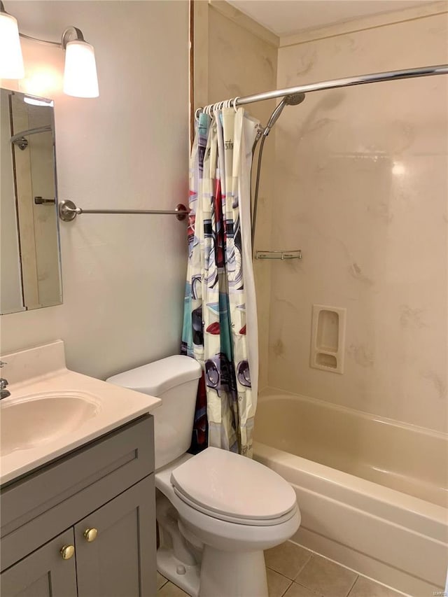 2903 Lesmer Ct, Overland, MO 63114 - full bath featuring tile patterned flooring, shower / bath combo, toilet, and vanity