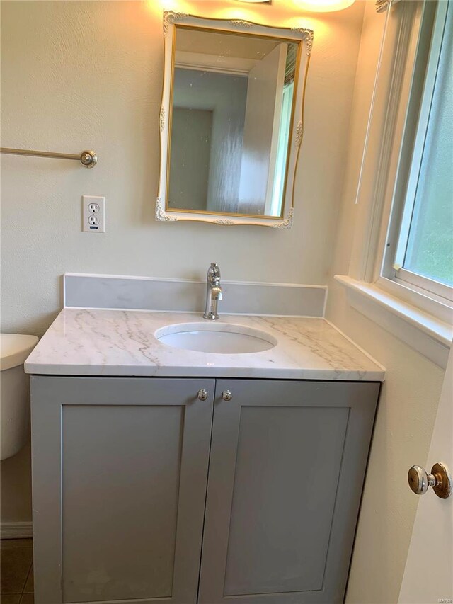 2903 Lesmer Ct, Overland, MO 63114 - half bath with vanity and toilet