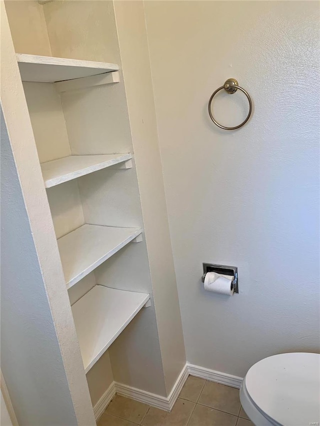 2903 Lesmer Ct, Overland, MO 63114 - bathroom featuring tile patterned floors, baseboards, and toilet