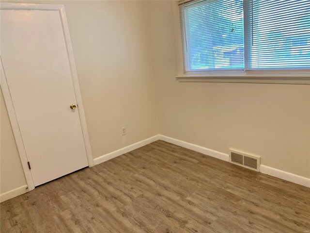 2903 Lesmer Ct, Overland, MO 63114 - spare room featuring wood finished floors and baseboards