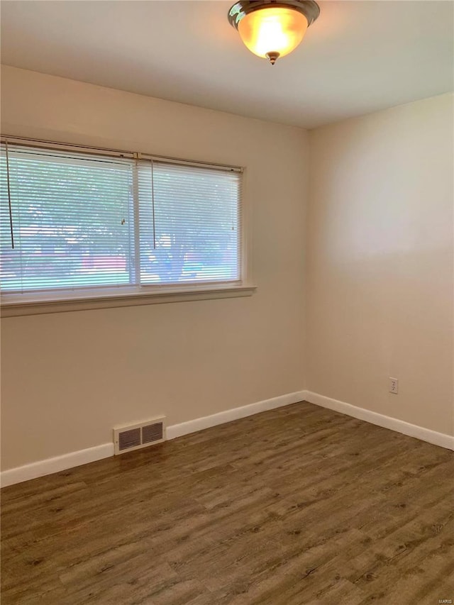 2903 Lesmer Ct, Overland, MO 63114 - unfurnished room with wood finished floors and baseboards
