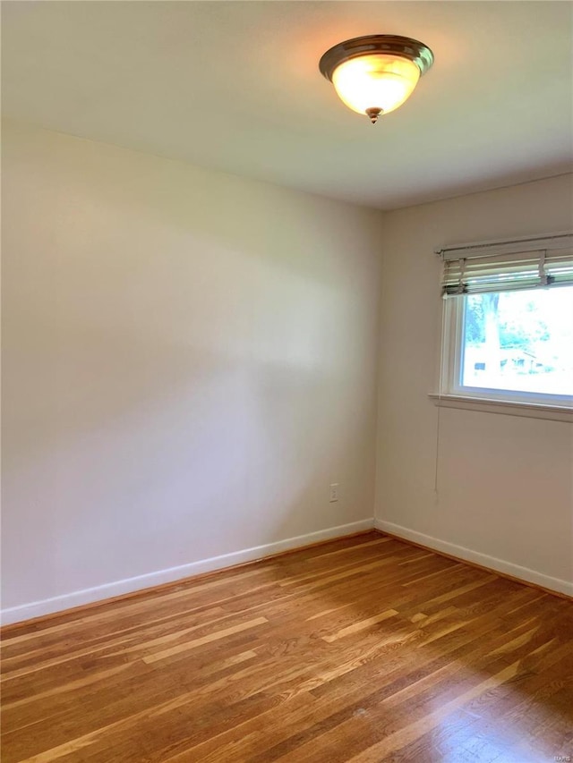 2903 Lesmer Ct, Overland, MO 63114 - unfurnished room featuring light wood-style flooring and baseboards