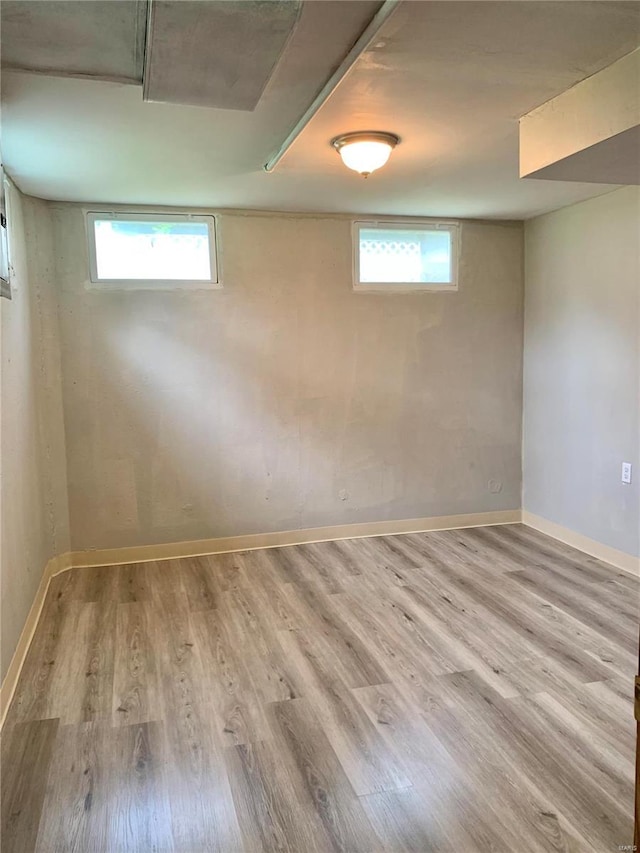 2903 Lesmer Ct, Overland, MO 63114 - below grade area with wood finished floors and baseboards