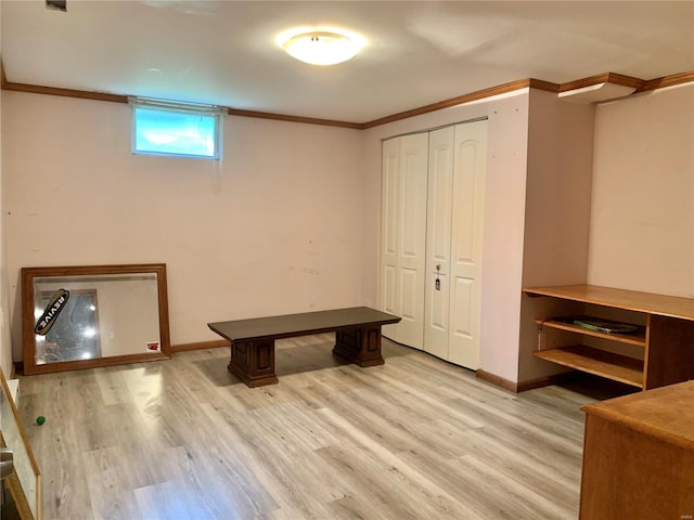2903 Lesmer Ct, Overland, MO 63114 - below grade area with light wood-style flooring, crown molding, and baseboards