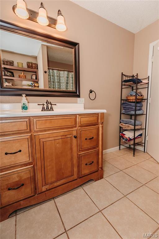12561 Carroll Dr, Rolla, MO 65401 - bathroom featuring tile patterned flooring, vanity, and baseboards