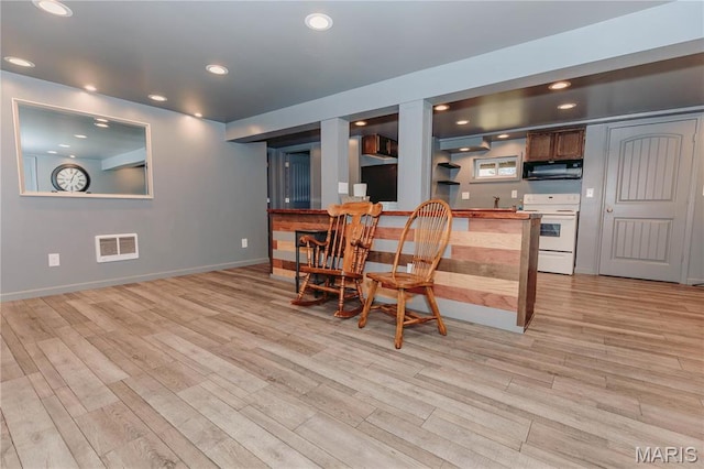 12561 Carroll Dr, Rolla, MO 65401 - dining room featuring light wood-style flooring, baseboards, recessed lighting, and bar