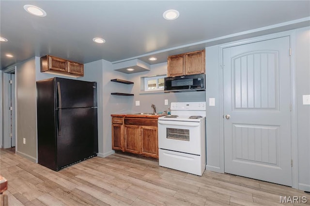 12561 Carroll Dr, Rolla, MO 65401 - kitchen featuring black appliances, brown cabinetry, light wood-style flooring, a sink, and open shelves