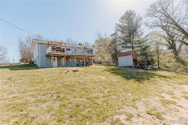 12561 Carroll Dr, Rolla, MO 65401 - rear view of property with a storage shed, an outbuilding, a wooden deck, and a yard