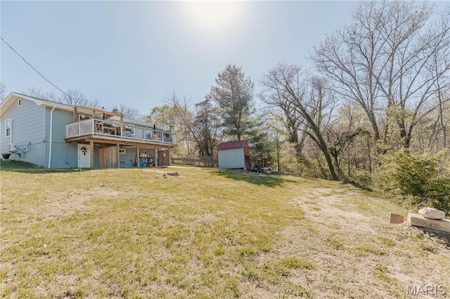 12561 Carroll Dr, Rolla, MO 65401 - view of green lawn featuring a shed, an outdoor structure, and a wooden deck