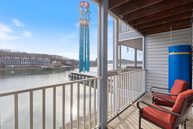 balcony featuring a water view