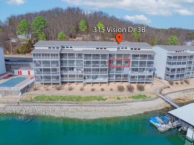 bird's eye view of a large body of water and apartment complex