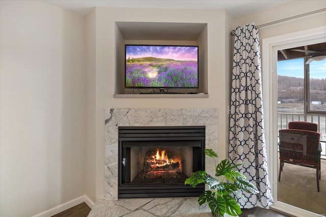 detailed view of a fireplace and baseboards