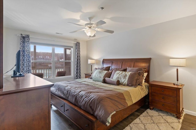 bedroom featuring wood finished floors, a ceiling fan, and baseboards